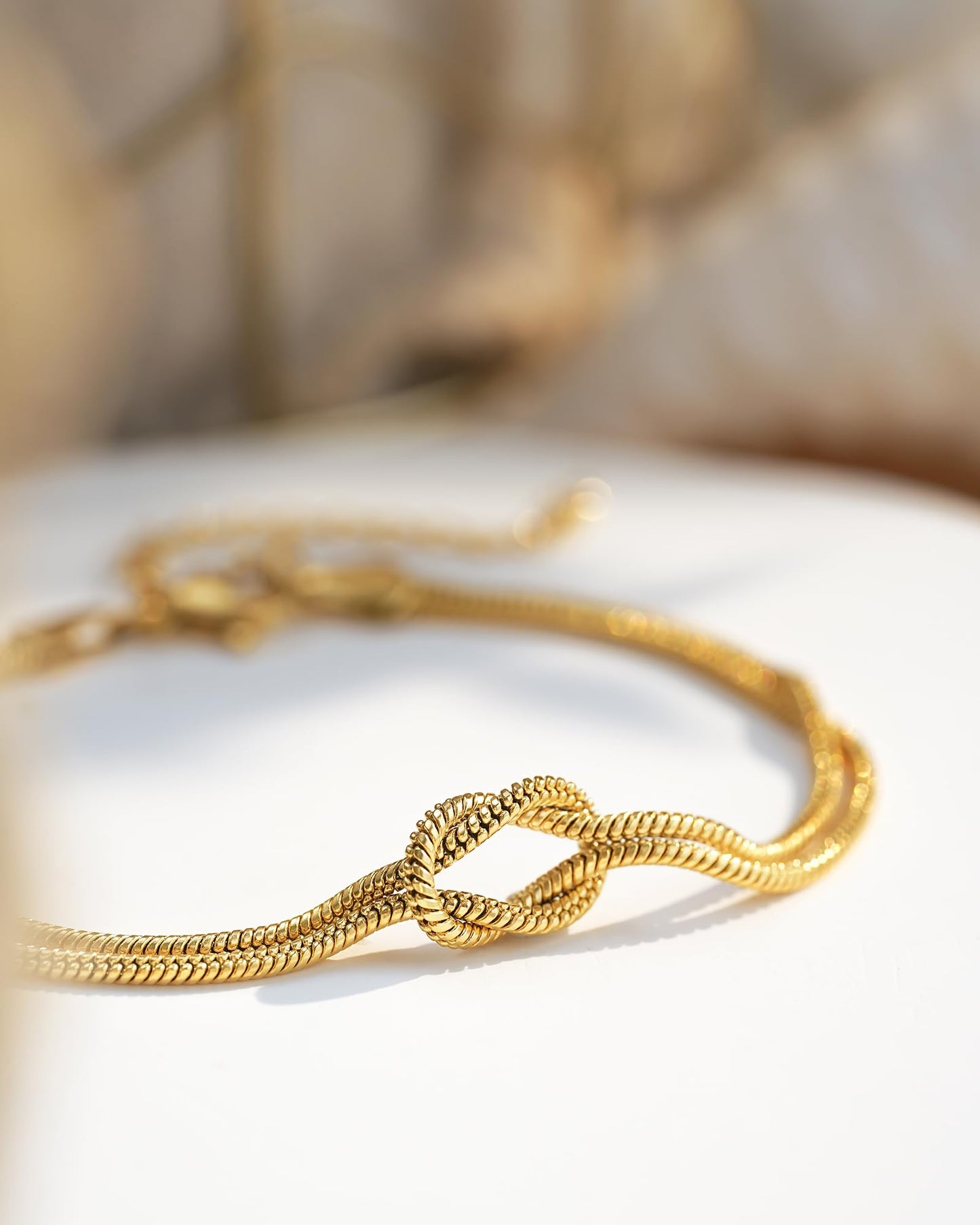 Women's Gold-Tone Stainless Steel Love Knot Charm Bracelet – Adjustable Chain