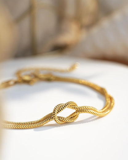 Women's Gold-Tone Stainless Steel Love Knot Charm Bracelet – Adjustable Chain